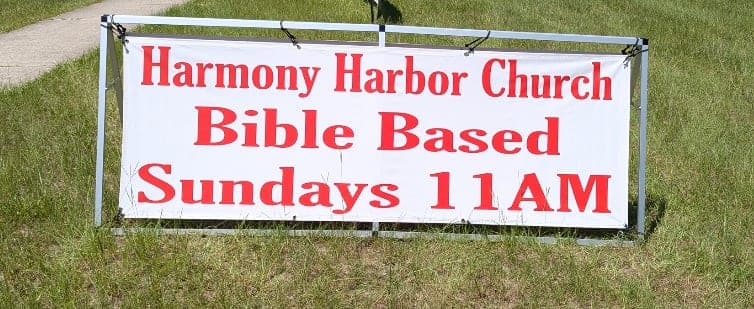 Harmony Harbor Church banner on SW Archer Rd — Bible Based, Sundays 11 AM